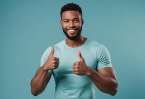 AI Generated A friendly man in a teal t-shirt smiling at the camera, making the thumbs up sign with both hands, exuding approachability and positivity. photo