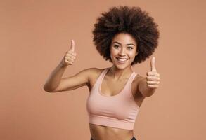AI Generated A woman with vibrant curly hair gives an enthusiastic thumbs up in sportswear, exuding positivity. photo
