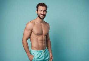 AI Generated A shirtless man with a fit physique stands in teal shorts, conveying a relaxed fitness vibe against a teal backdrop. photo