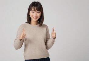 AI Generated A cheerful woman in a beige sweater gives two thumbs up, signaling her positive and friendly attitude. photo