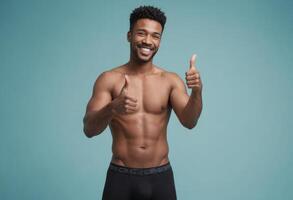 ai generado un muscular hombre sin un camisa da un pulgares arriba. su radiante sonrisa y atlético construir exudar confianza y fortaleza. foto