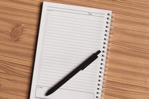 Blank checklist with space for ticks on notepad with wooden background. photo