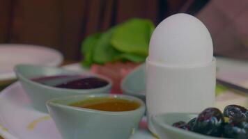 Close egg in cups for morning breakfast video