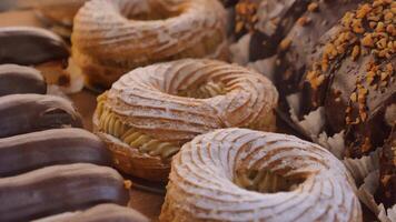 chocolate donuts and cake items displaying at local cafe store video