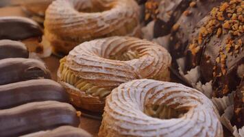 chocolate donuts and cake items displaying at local cafe store video