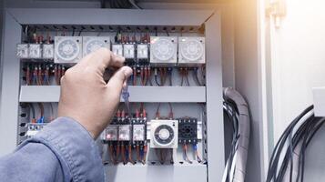 Checking the electrical power on the control panel using a test pen. photo