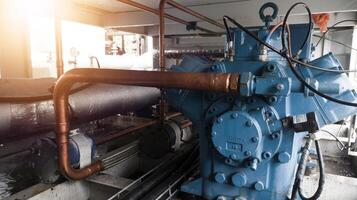 Instalation of compressor chiller unit and refrigerant system ,with refrigerant pipe and cable power. Industrial chiller water cold instalation. photo