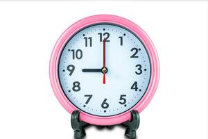 Beautiful pink clock show time of nine o'clock isolated on white background with clipping path. photo