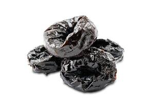 Pile of dried pitted prunes on white background with clipping path. photo
