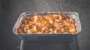 Baked potatoes in the oven with spices.  food photo