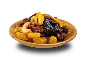 Various dried fruit in a wooden plate on white background with clipping path. photo