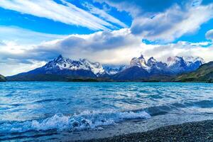 Wave at Lake Pehoe and the mountain in Torres Del Paine National Park, Chile photo