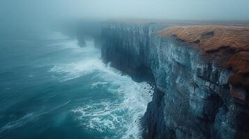 AI generated rugged coastline, with cliffs plunging into the sea and waves crashing against the rocks photo
