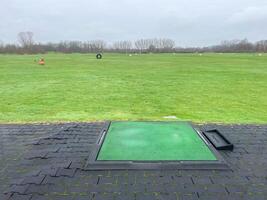 Driving range on a golf course photo