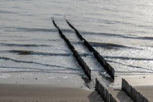 breakwaters wooden piles protect the coast photo