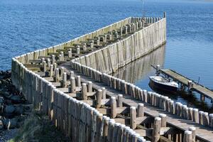 breakwaters wooden piles protect the coast photo