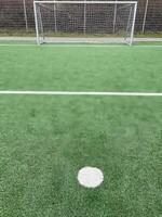 penalty spot in front of a soccer goal photo