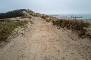 wide path high above the dunes on the north sea Zeeland Netherlands photo