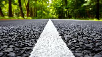 AI generated Empty road with white line leading through a green forest photo