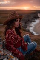 AI generated Cowgirl enjoying a serene sunset on a coastal cliff photo