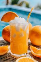 AI generated Fresh orange juice in a glass with ice by the pool photo
