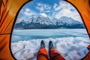 AI generated View from tent onto frozen mountain lake photo