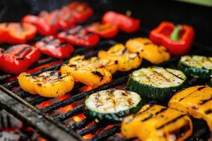 AI generated Grilled vegetables on a grill, red pepper and yellow pepper, zucchini. photo