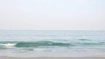 Summer sea in sunny day beautiful Tropical seashore scenic in phuket beach with wave crashing on sandy beach,wave hit the beach with white bubble, summer holiday vacation video