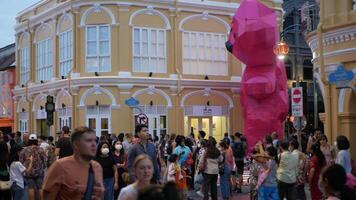 crowded tourist people shopping walking relaxing at Thalang Road and surrounding area on Chinese newyear festival or Phuket Festival 2023 light illumination night time video