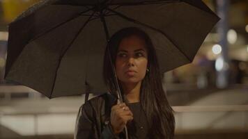 Thoughtful Young Woman Thinking about Life Outside in the Rain at Night video