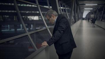 Male Business Person Standing Out of The Crowd Inside Trainstation video