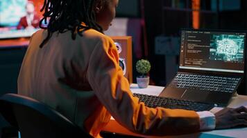 African american girl uses artificial intelligence software for machine learning and cloud computing, terminal window programming language. IT student studying deep learning AI hardware. Camera A. video