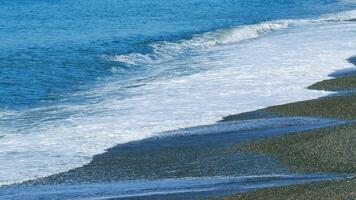 Waves Runs On Coastal Pebble. Ocean Waves On Beach. Beach With Pebble That Carries The Waves To The Shore. Slow motion. video