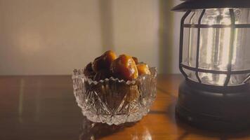 motion background a bowl of dates on a table next to a lantern video