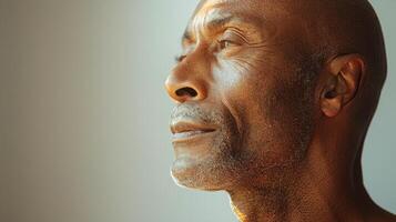 AI generated An artistic close-up of a bald man's profile, with the contours of his face and the smoothness of his scalp accentuated by soft lighting photo