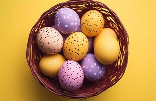 AI generated colorful easter eggs nestled in a wicker basket on yellow background photo