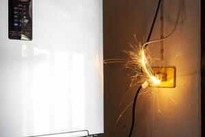 Electric shock, plug, Refrigerator Therefore causing sparks Dangerous concepts from the use of old electrical appliances And without quality Therefore is dangerous to life and property photo