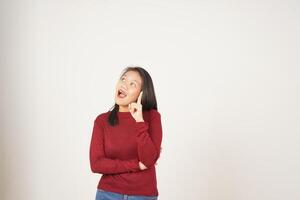 Young Asian woman in Red t-shirt  thinking gesture and got idea isolated on white background photo