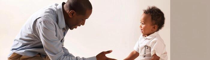 AI generated Father kneeling down to his toddler son's level, offering guidance or assistance with a warm smile, against a clean white background, generative AI photo