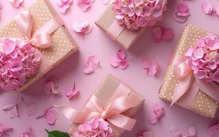 A top down view capturing elegantly packaged presents decorated with pink hydrangea blooms and soft petals strewn about photo