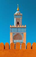 AI generated The complex designs of a minaret tower are prominent against the backdrop of a clear blue sky photo