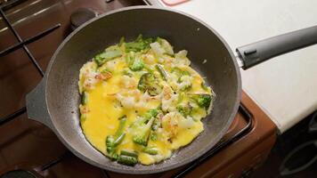 vegetable stew with egg boiling in a frying pan video