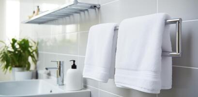 AI generated white towels hanging on a towel rack in a modern bathroom photo