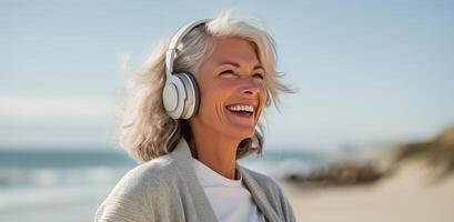 AI generated A woman over 50 dances on the beach wearing headphones, enjoying the moment photo