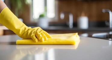 AI generated woman washing kitchen counter with sponge in yellow rubber gloves photo