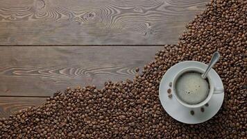 caucasian hand stirring black frothy coffee and with a spoon video