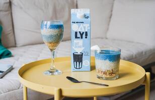 Muesli in a glass on the table in the living room photo