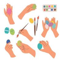 coloring eggs for easter time at home, hands hold eggs and brushes paint eggs vector