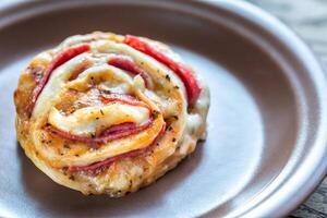 Pizza roll on the plate photo