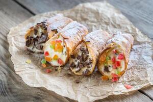 Cannoli stuffed with cream cheese photo